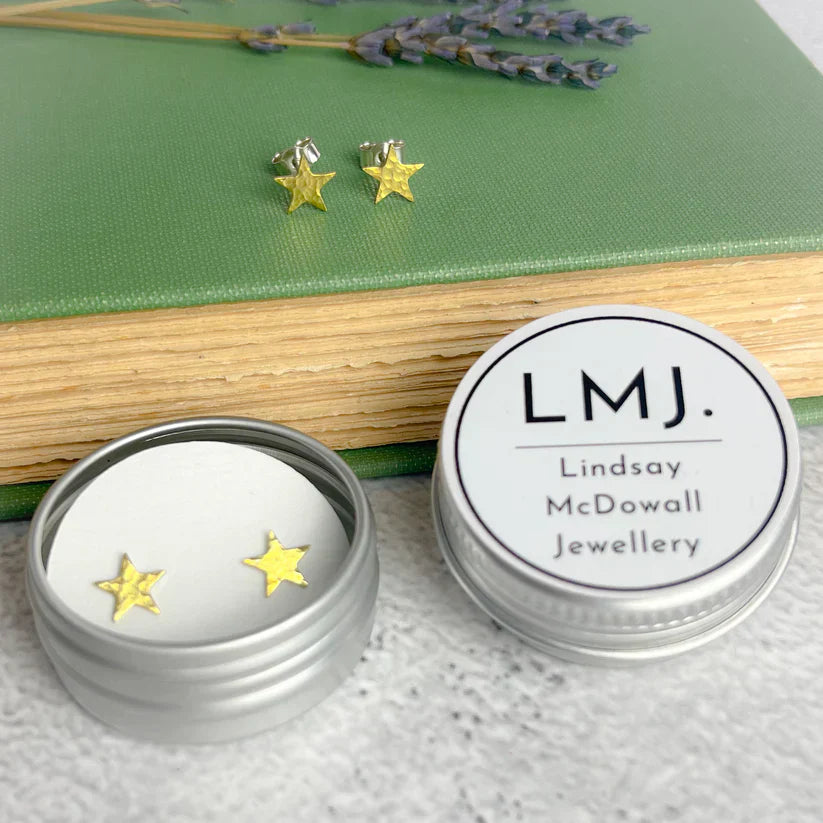 Brass star stud earrings in delicate gold nestled in silver tin by Lindsay McDowall Jewellery