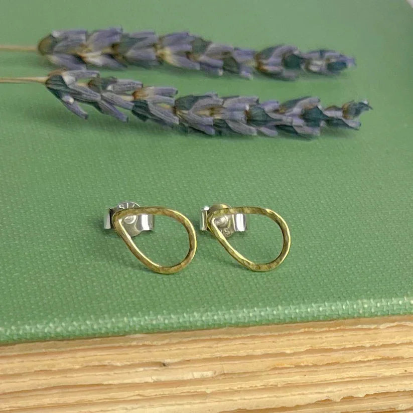 Gold-toned textured hand-forged hoop earrings with silver backings