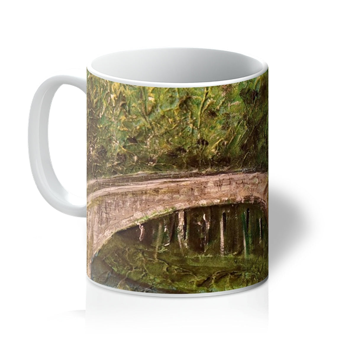 The Brig O Doon Mug: white ceramic with bridge design and greenery reflection