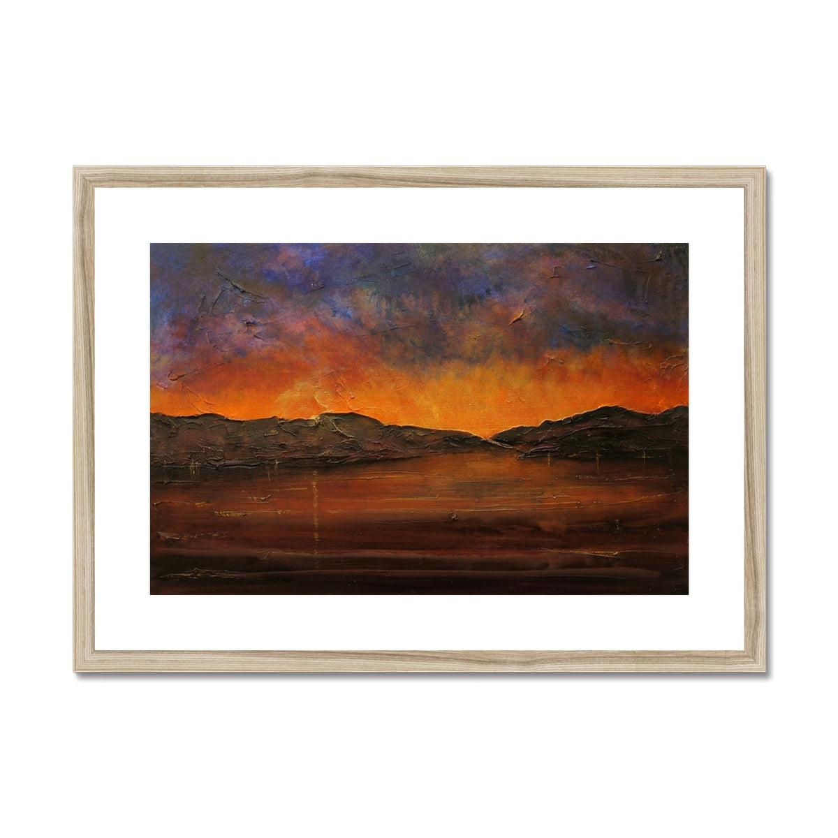 Wooden-framed landscape print of a serene sunset over hills in orange and purple hues