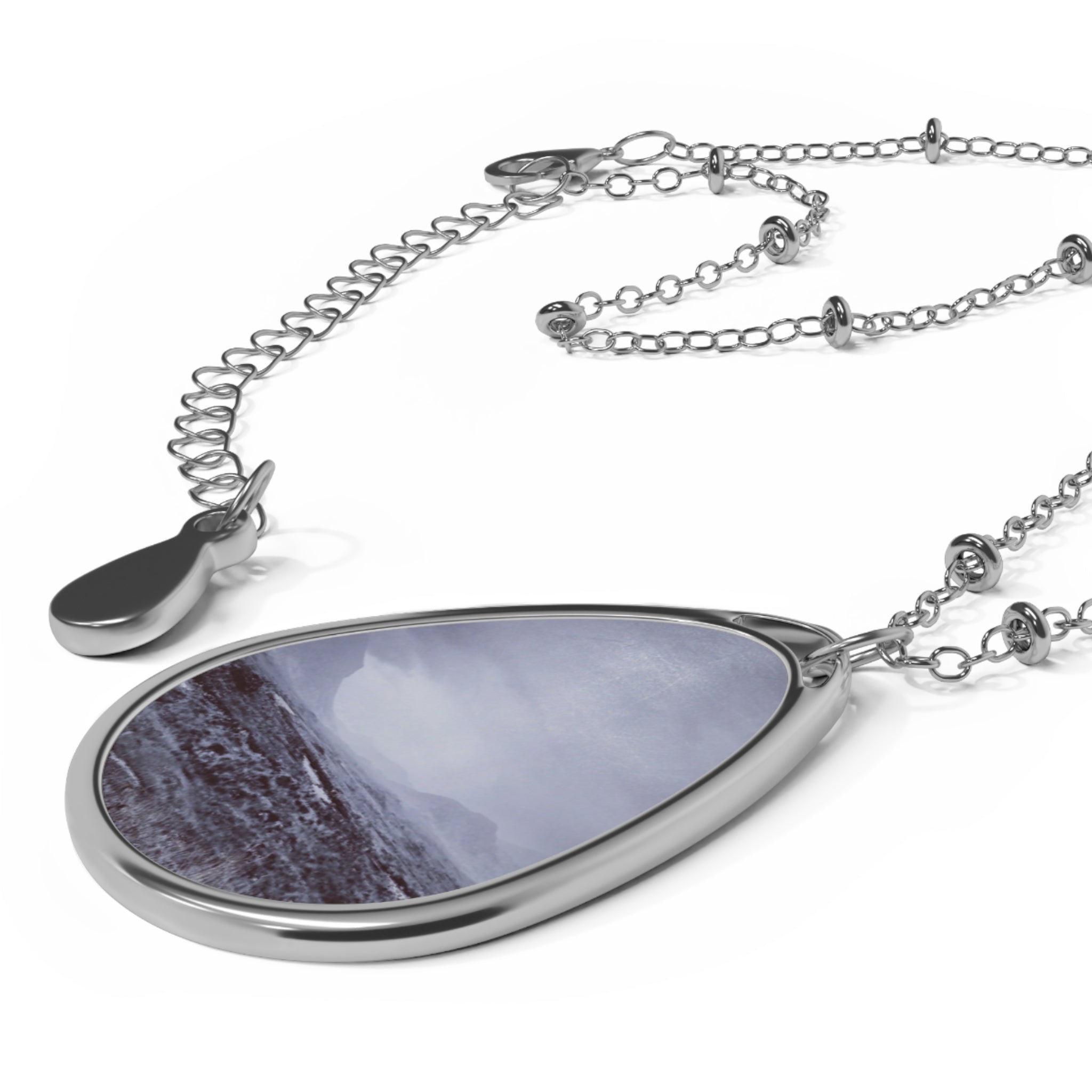 Silver teardrop pendant necklace with misty Cuillin mountains photo
