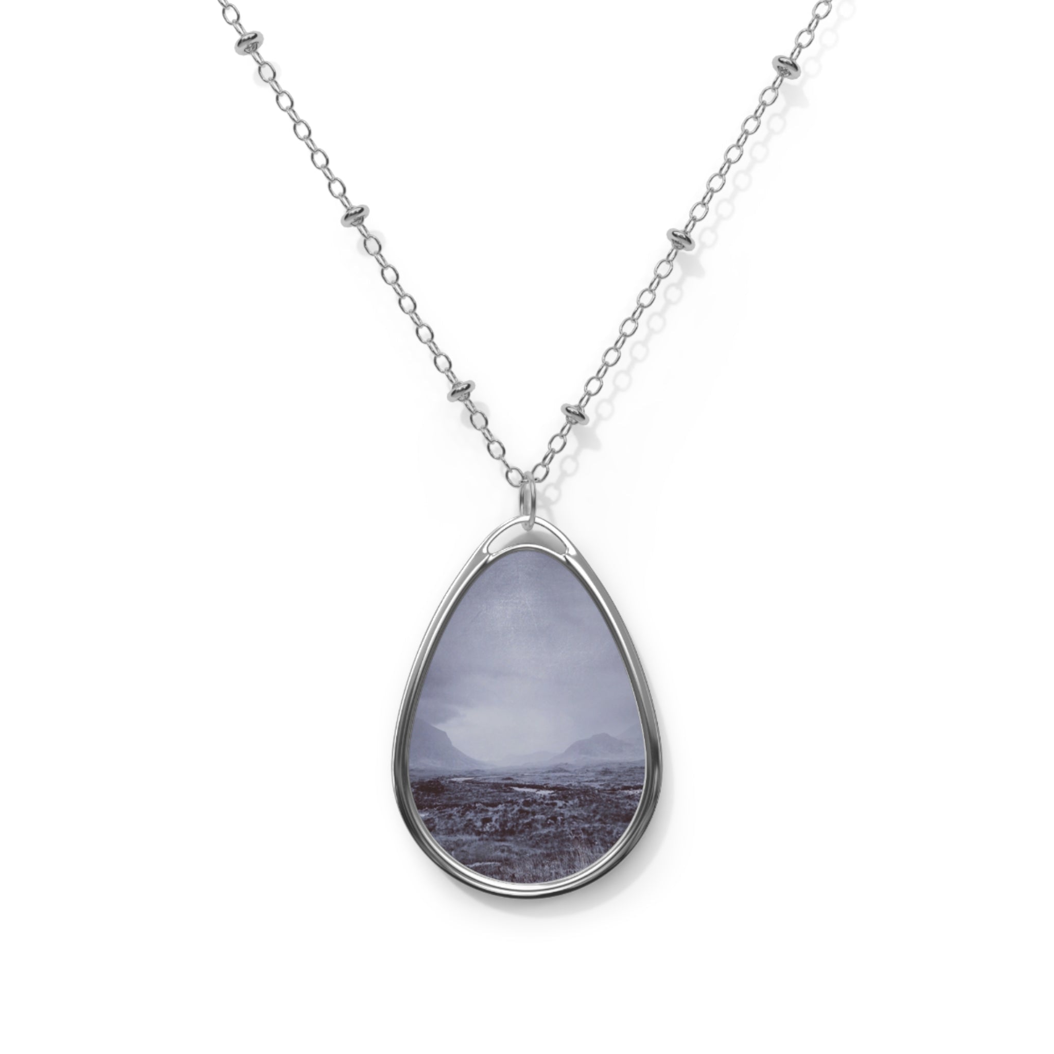 Silver teardrop pendant necklace with Brooding Cuillin framed landscape photo in muted purples and grays