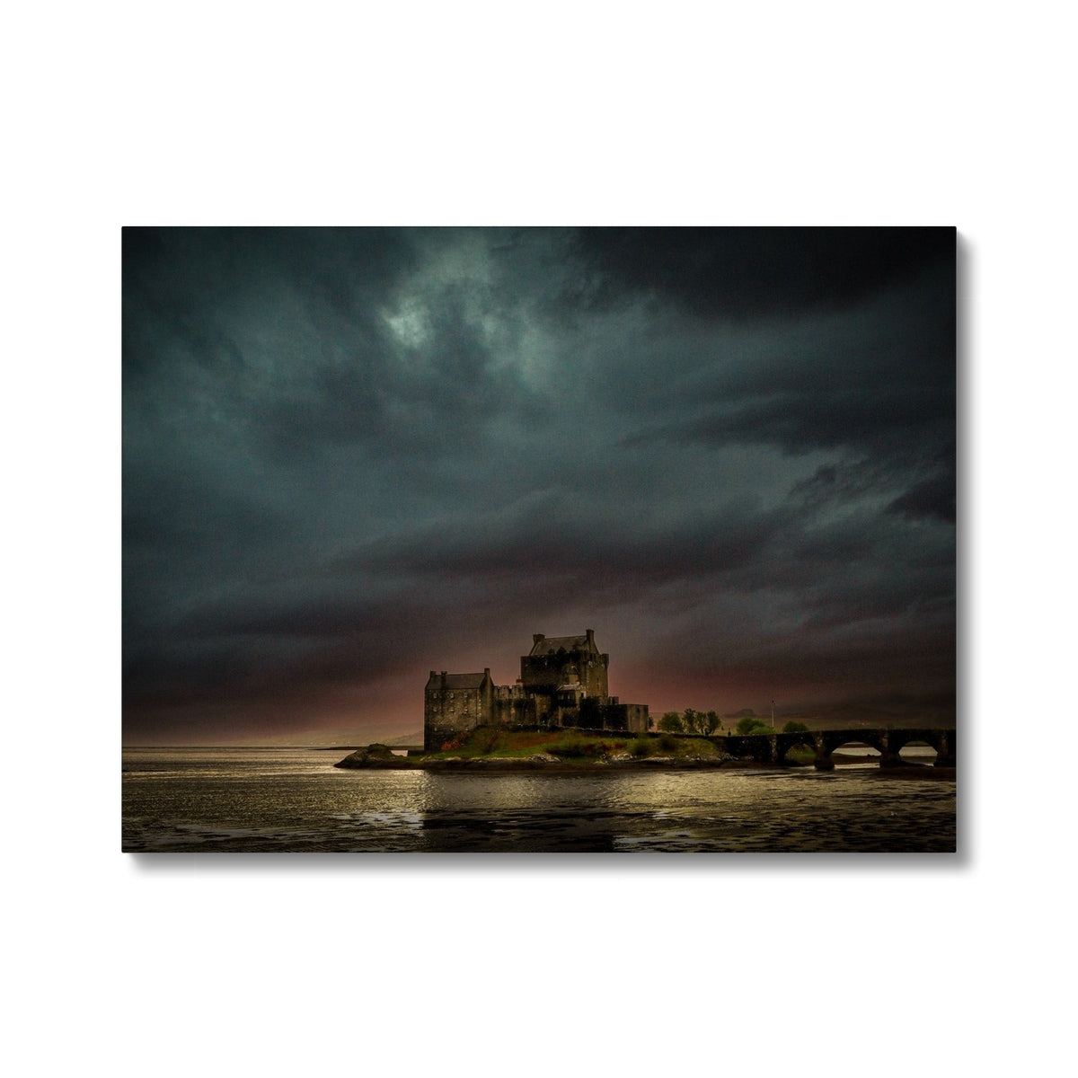 Brooding Eilean Donan Castle canvas print with dramatic sky and bridge
