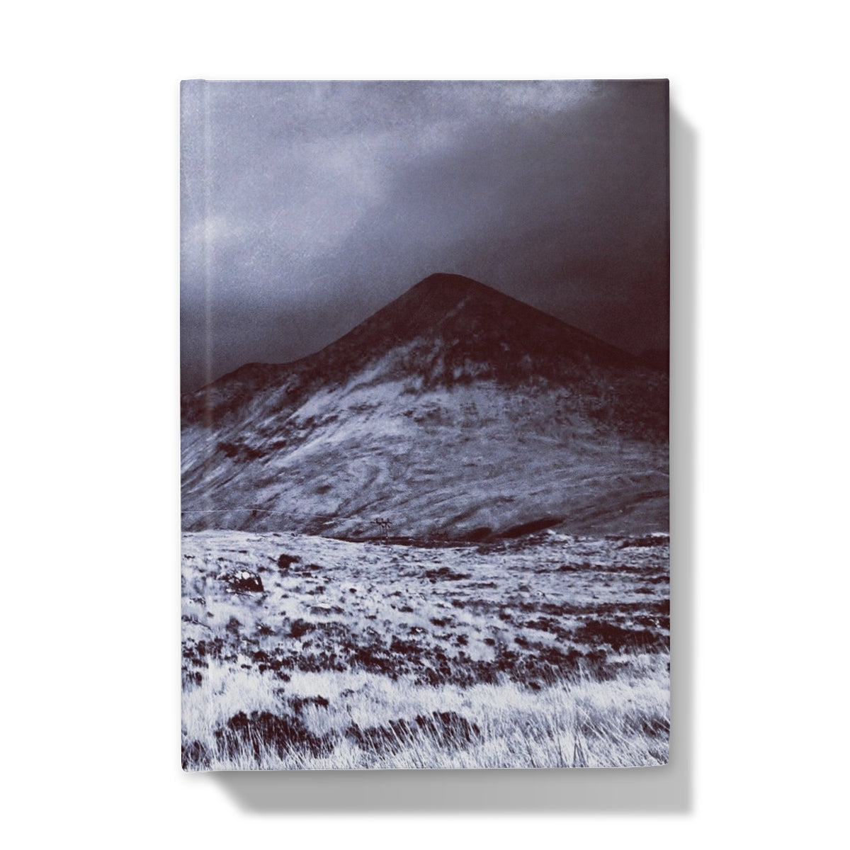 Canvas print of snowy Varagil mountain landscape with brooding clouds on journal
