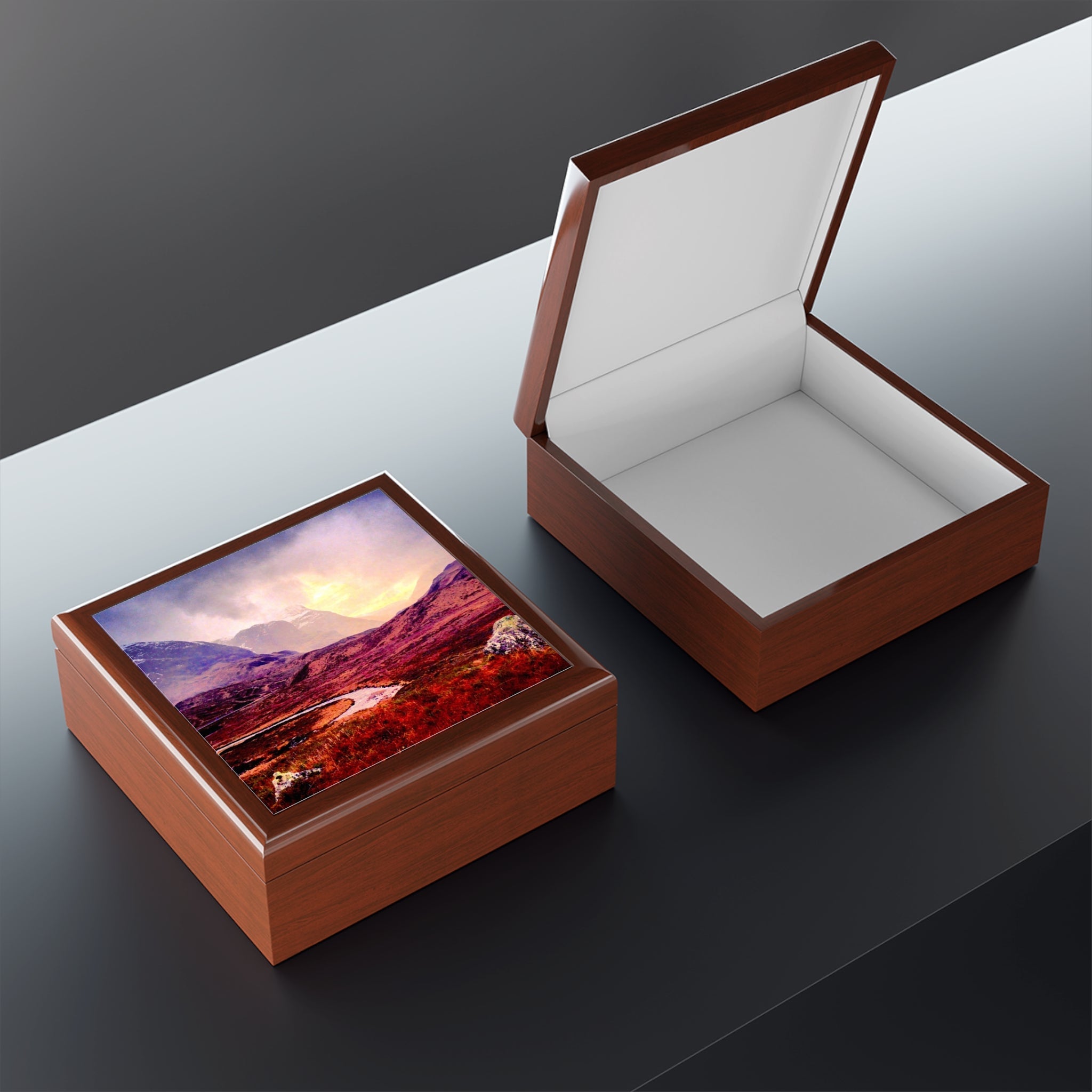 Open brown leather jewelry box with Glencoe mountain design on lid