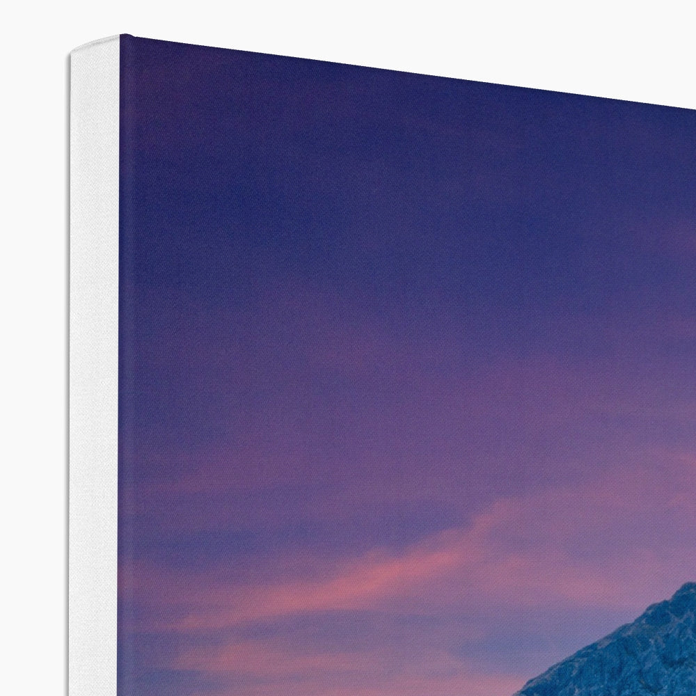 Buachaille Etive Mor dawn canvas print with purple-pink sunset and mountain silhouette