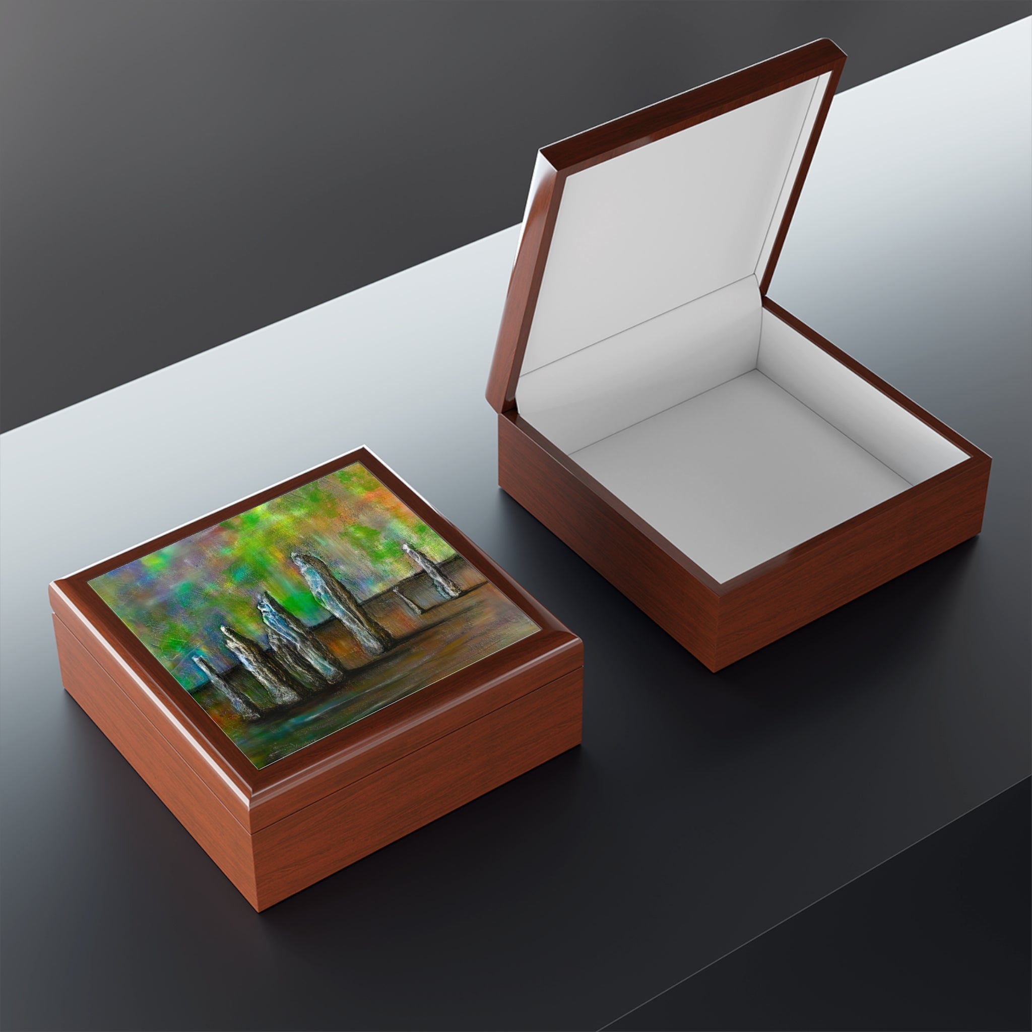 Brown wooden keepsake boxes with colorful abstract design on lid, one open and one closed