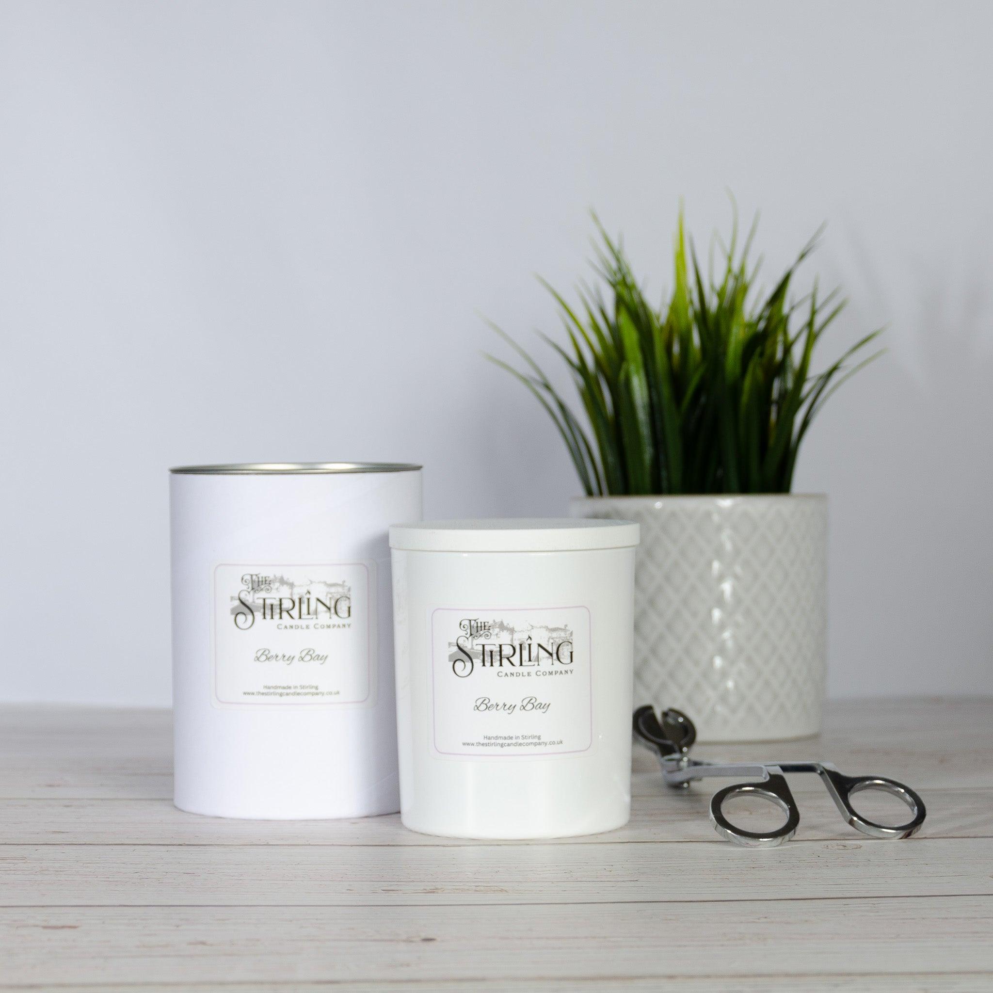 White cylindrical berry bay large candle from string candle company with silver lid and minimalist label
