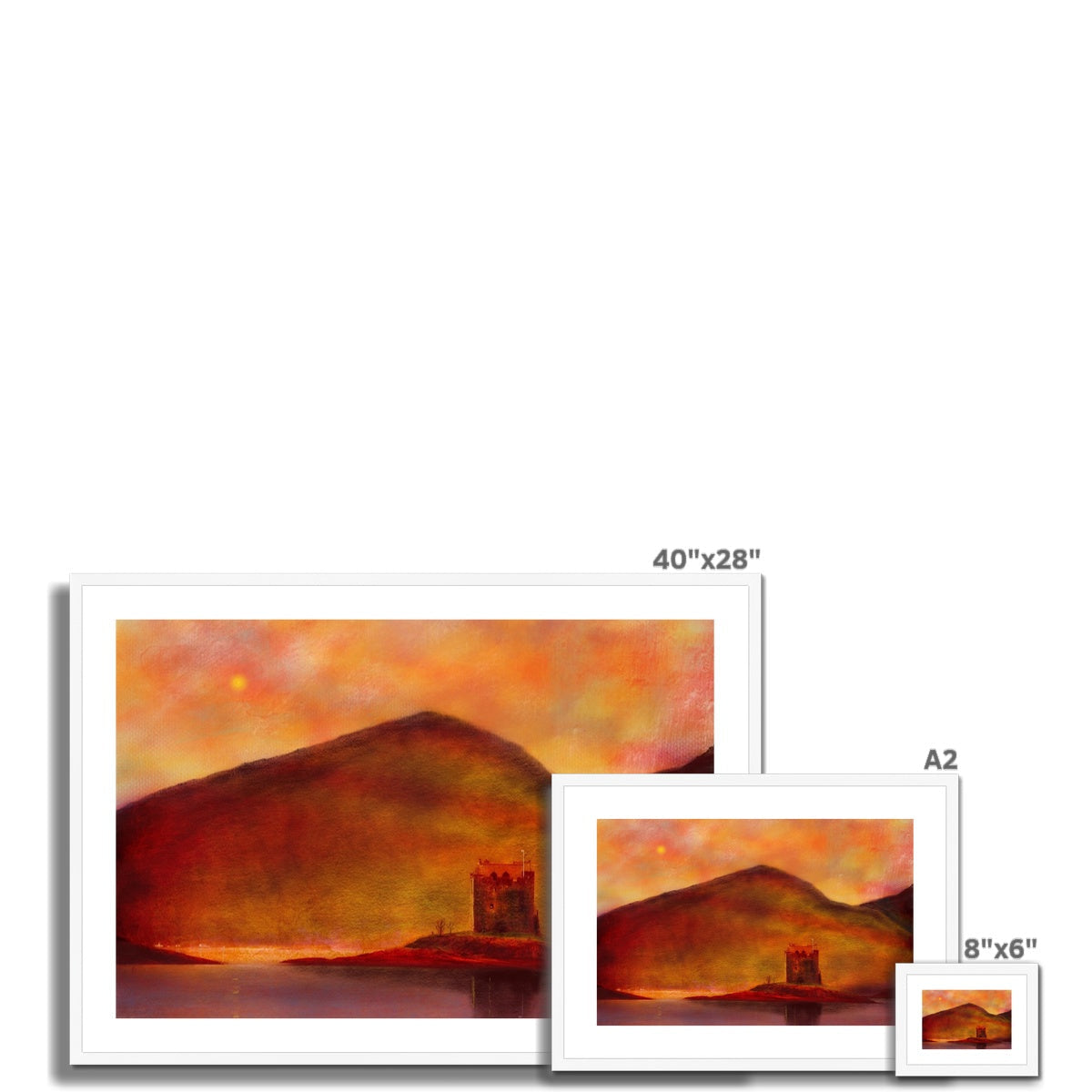 Three framed landscape prints of varying sizes featuring Castle Stalker Sunset displayed as a product
