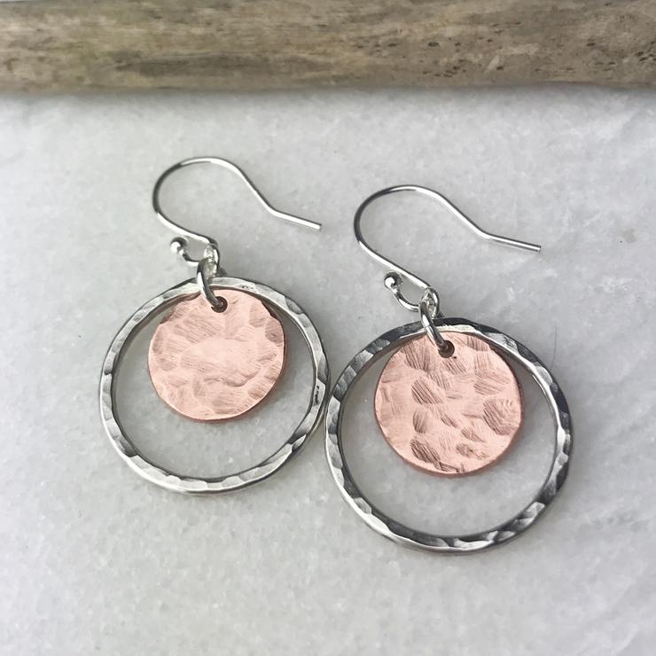 Hand-forged copper and silver copper disc earrings with hammered texture and hoop design