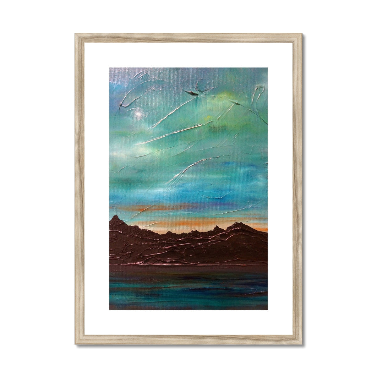 Framed and mounted print of a mountainous landscape under a vibrant sky titled The Cuillin From Elgol