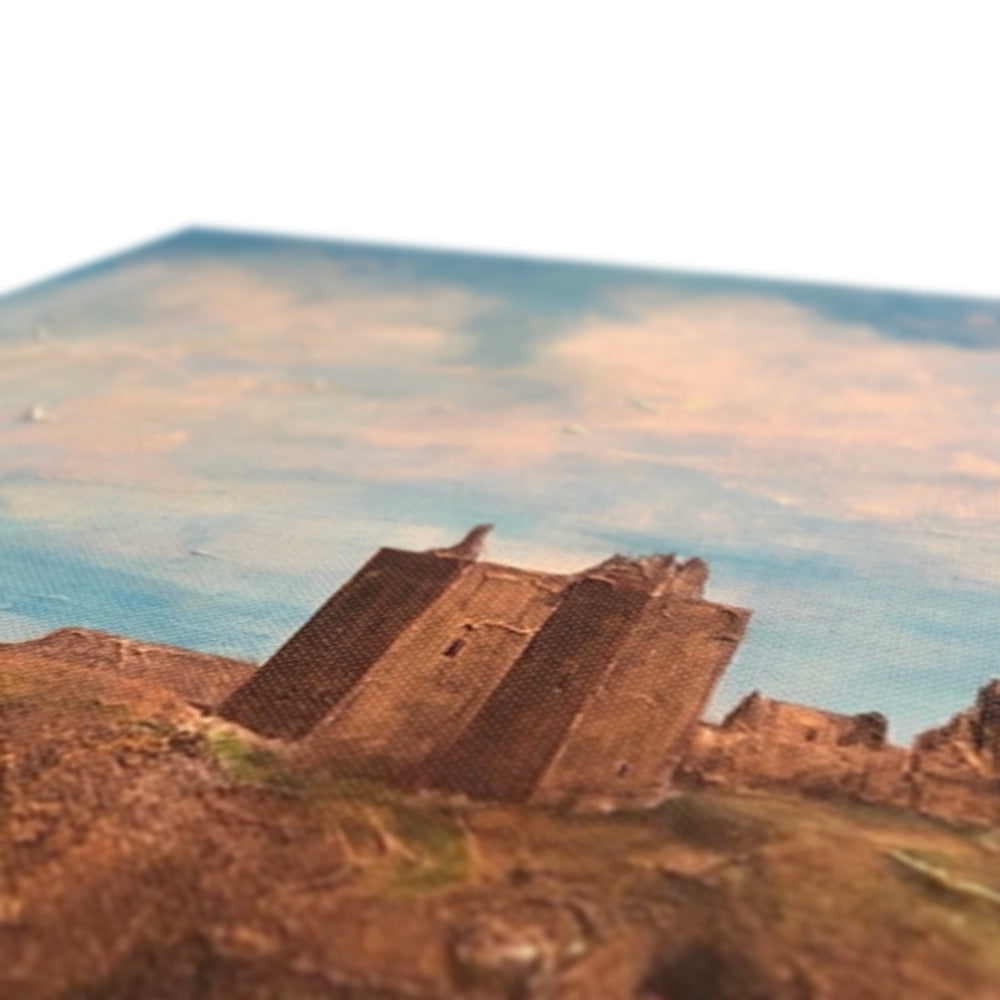 Tilted, weathered stone ruins on a cliff overlooking the sea.