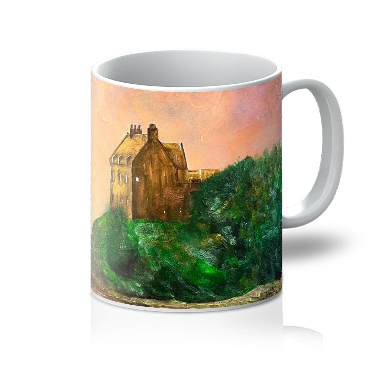 White ceramic Duntrune Castle Mug with artistic painting of a stone building on a forested hill under a pink and orange sky