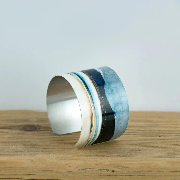 Winter Luskentyre Bangle: sleek wide cuff with silver interior and blue stripes