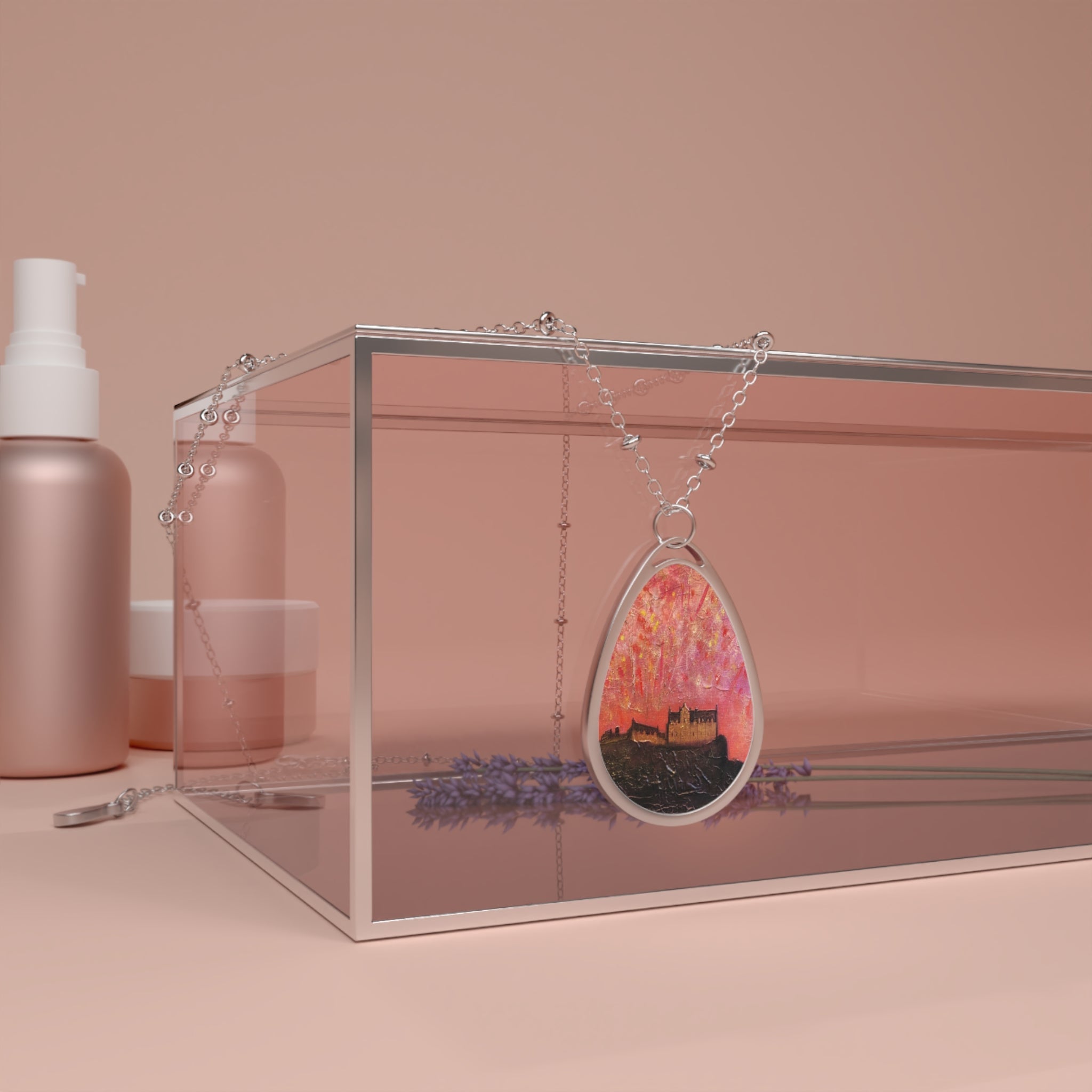 Silver teardrop pendant necklace with Edinburgh Castle silhouette at pink-orange sunset