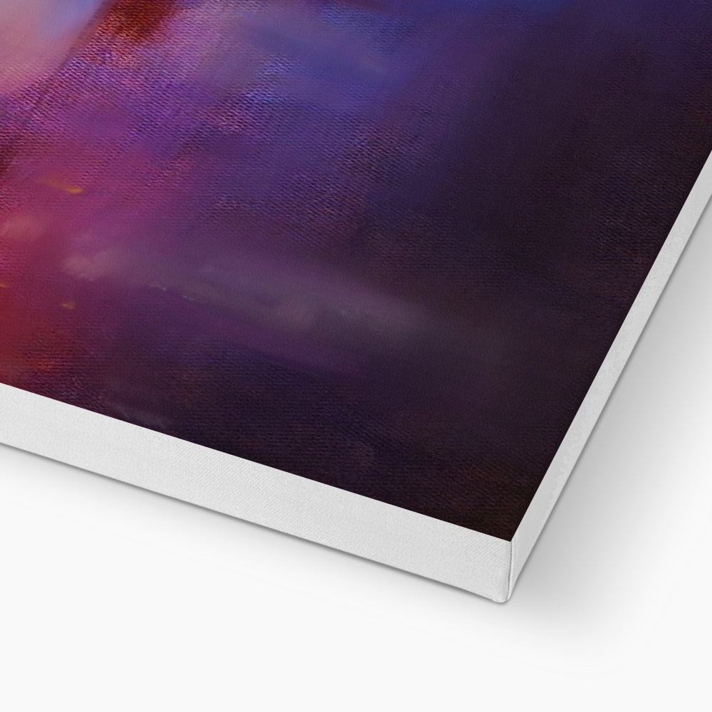 A canvas print with abstract purple and red hues.