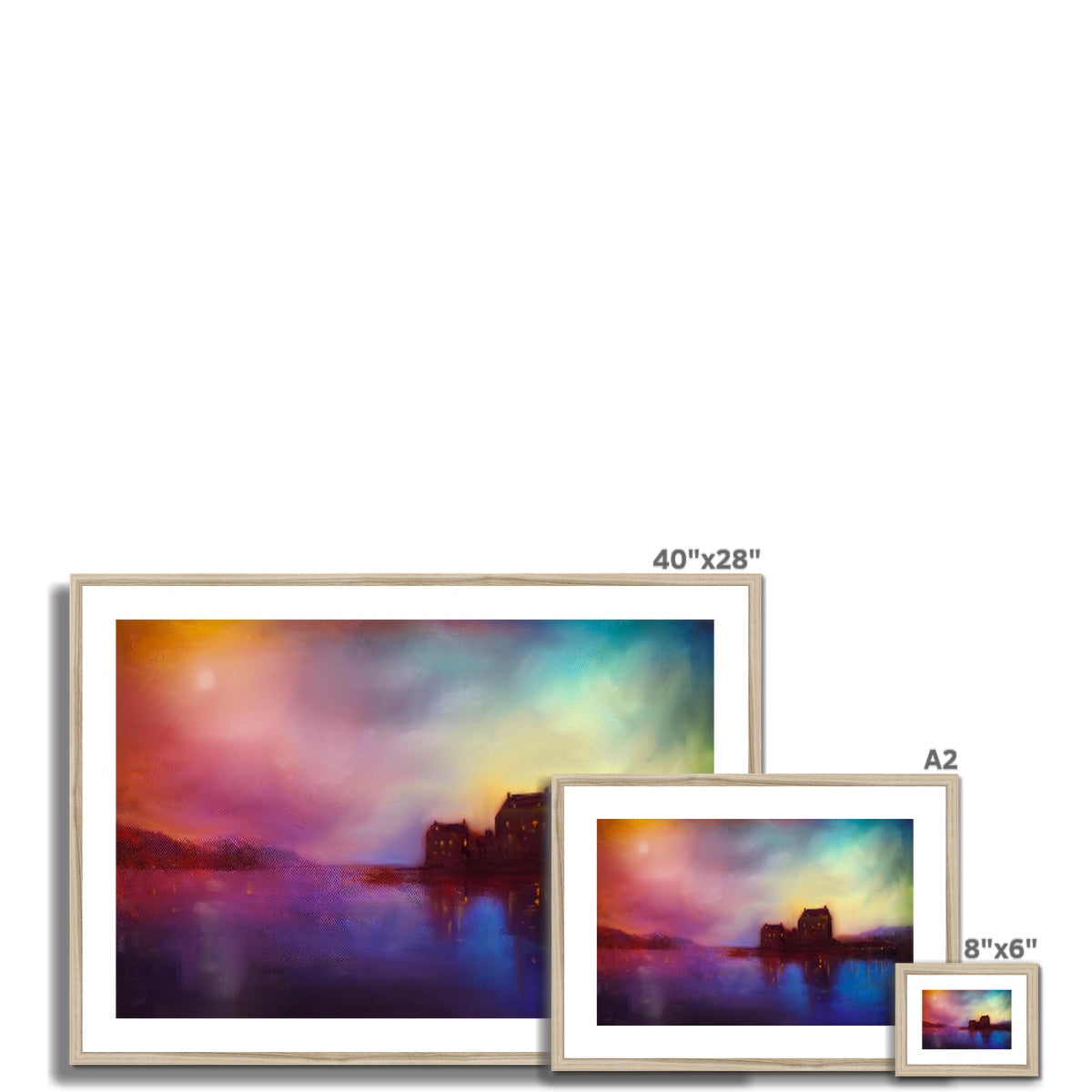 Three framed prints of a colorful landscape with a body of water and distant structures