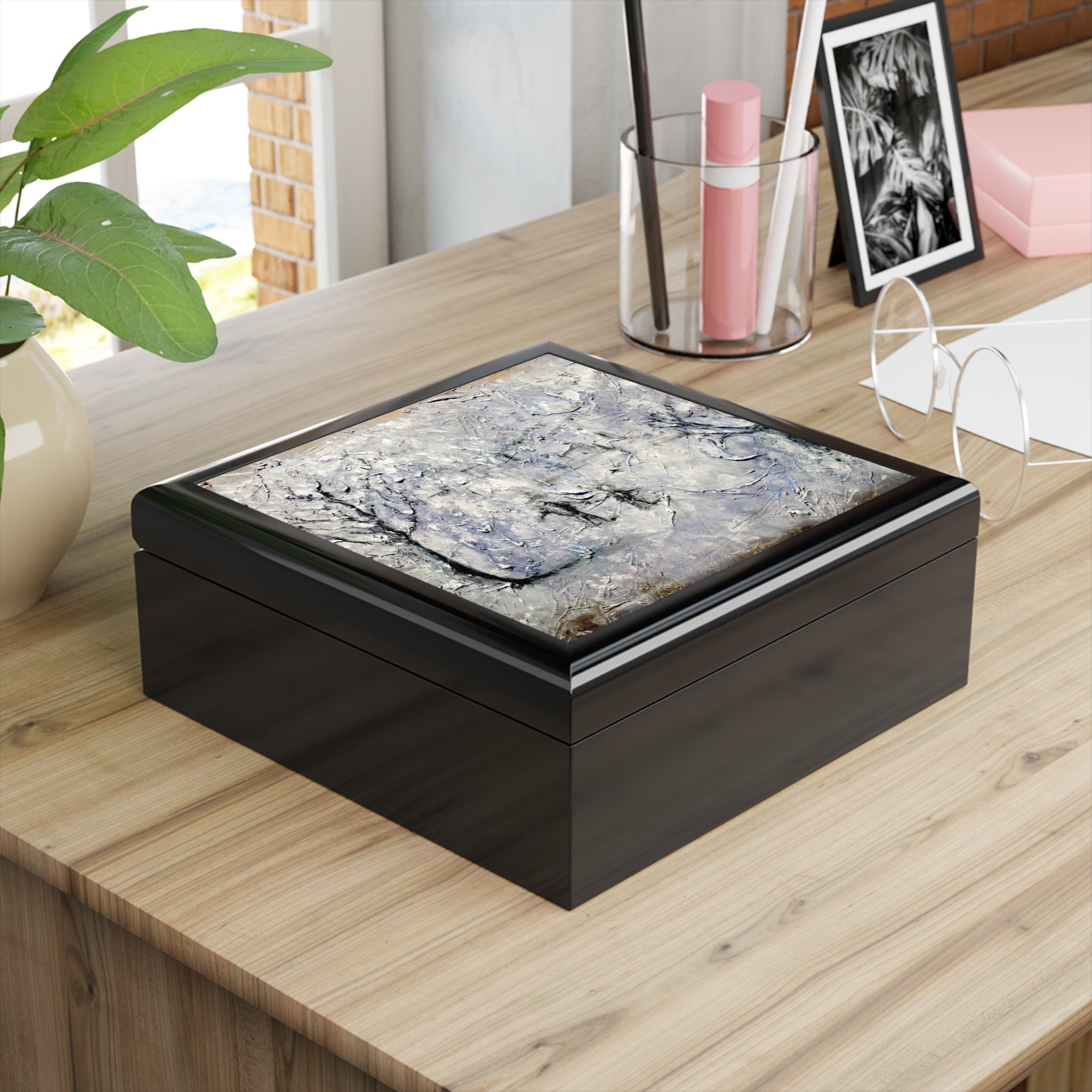 Black wooden jewelry box with textured gray and white marble-like lid from Scotland