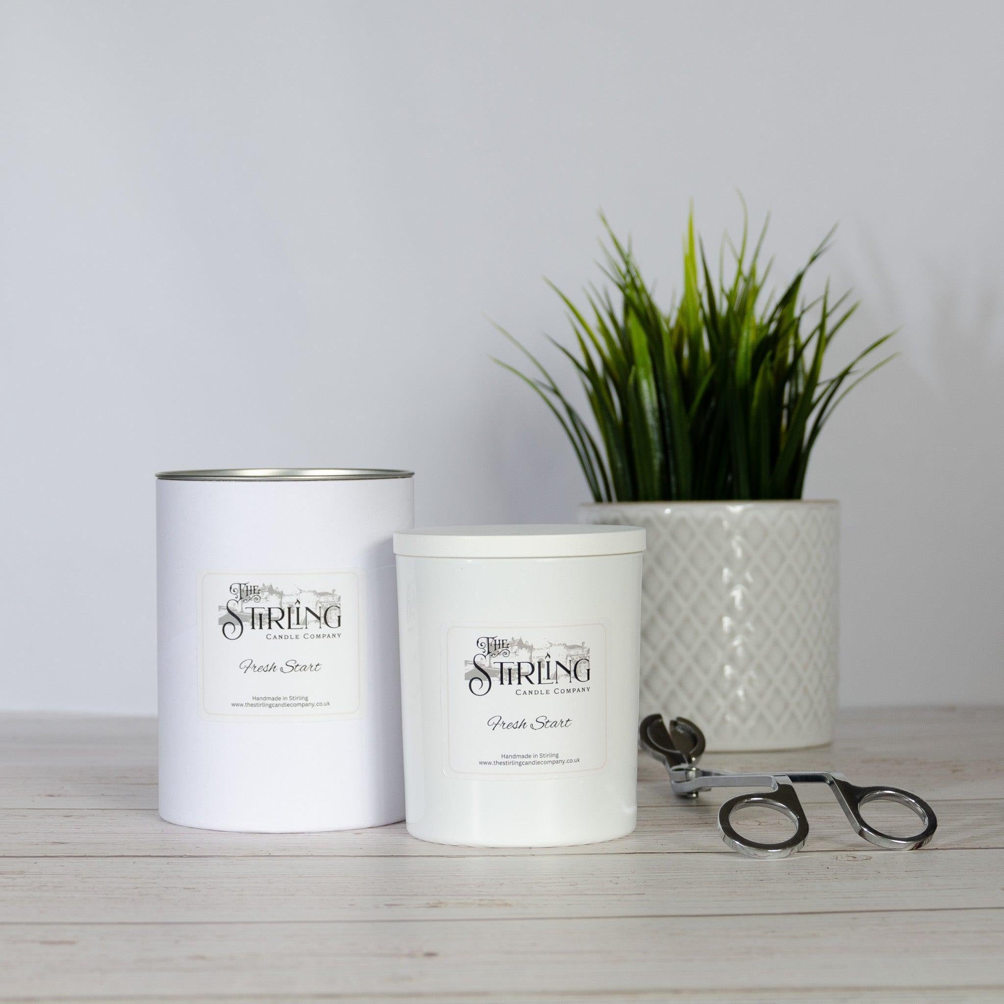 Fresh Start Large Candle in white jar with silver lid and black branding