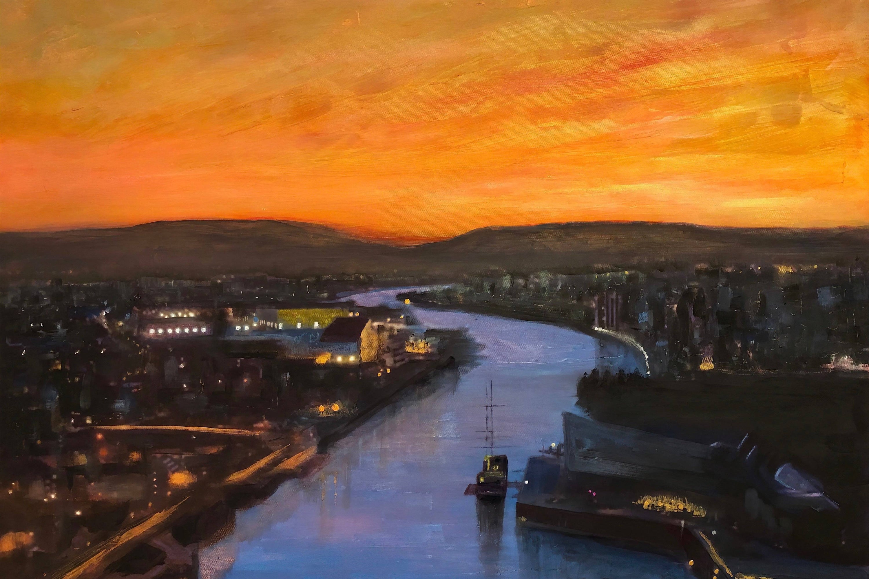 Aerial view of a river flowing through Glasgow Harbour at sunset in Scotland