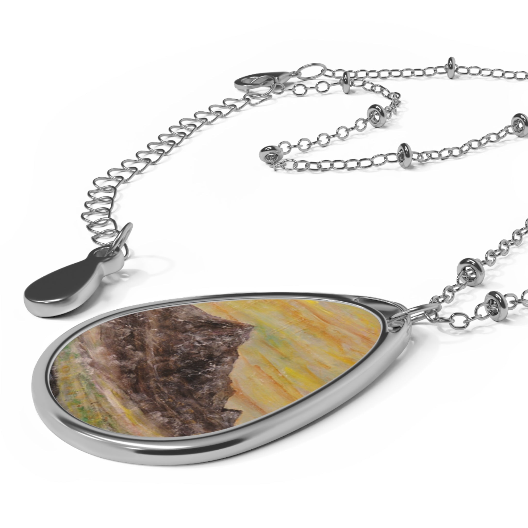 Silver-toned teardrop necklace with watercolor Scottish landscape design from Glen Rosa Mist Arran