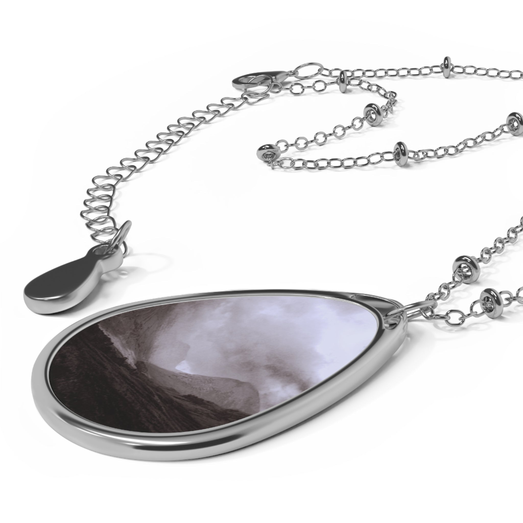 Silver teardrop pendant necklace with swirling grey and white design from Glencoe Mist Scottish Jewellery