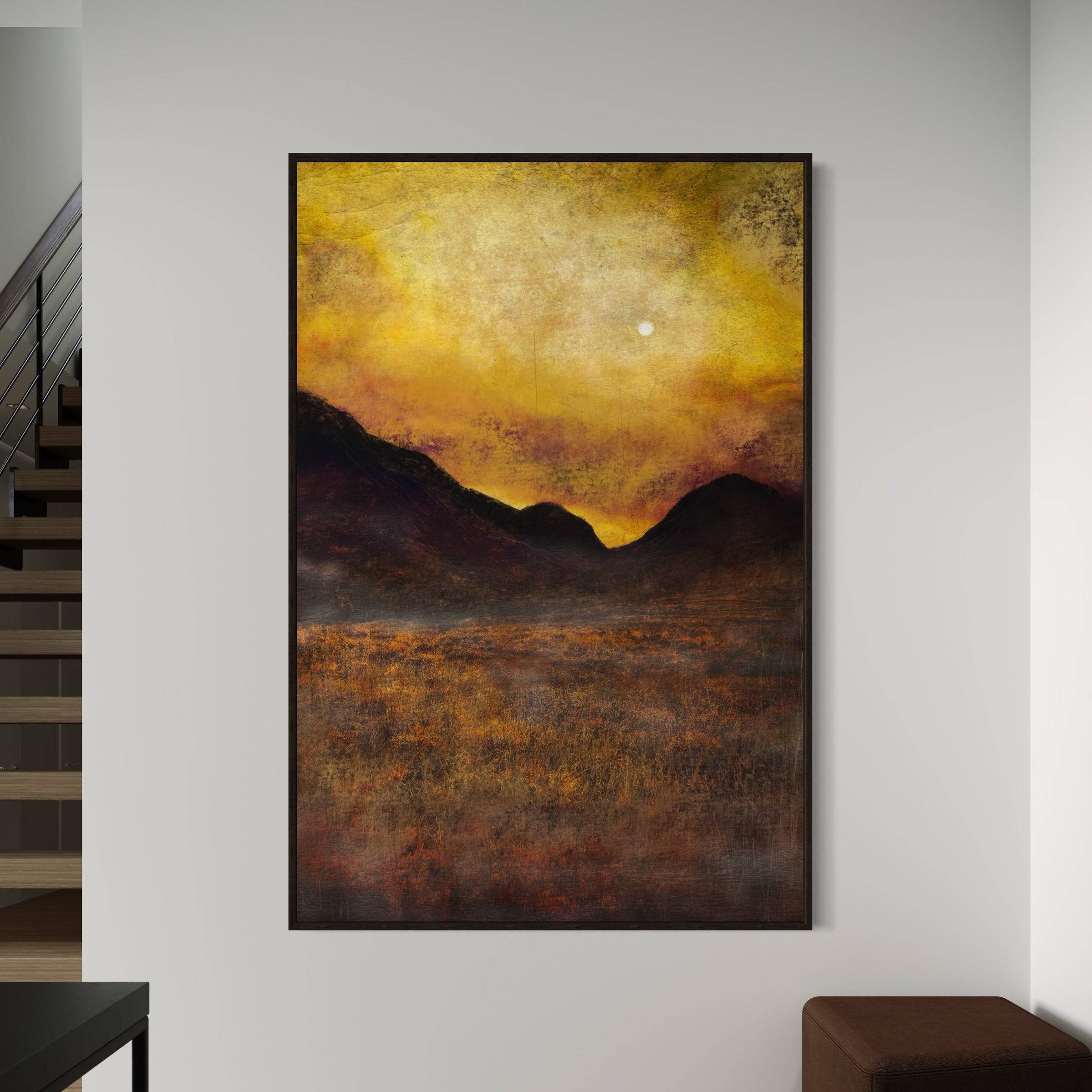 Framed abstract landscape painting with vibrant yellow and orange sky over dark mountains and textured field in Glencoe Moonlight wall art