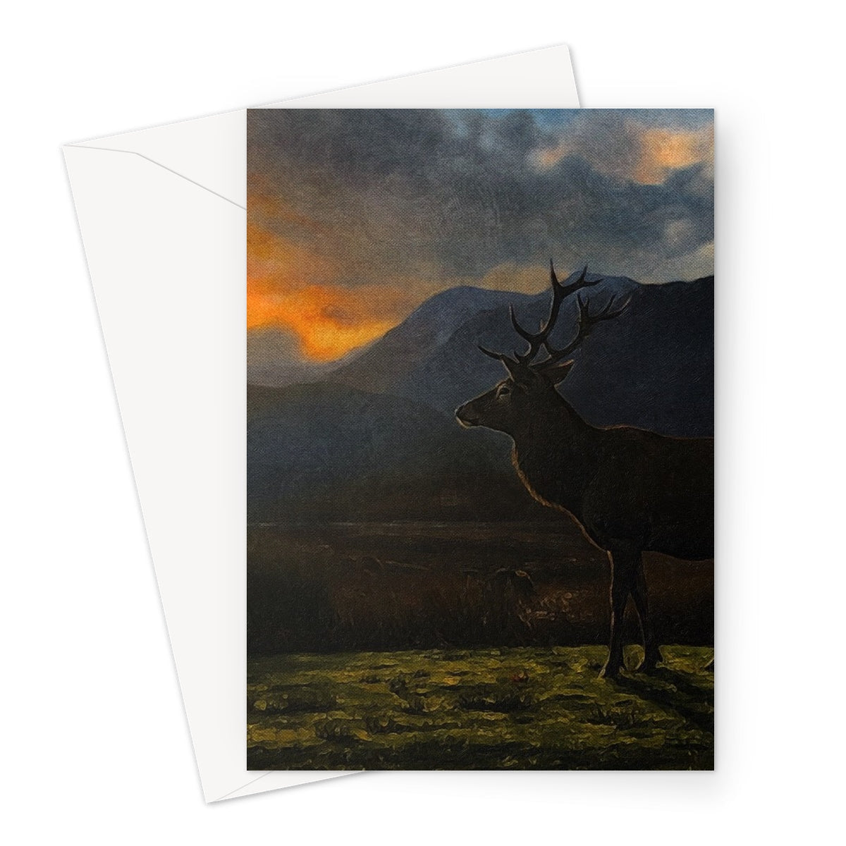 Silhouette of stag with antlers against Glencoe sunset mountains
