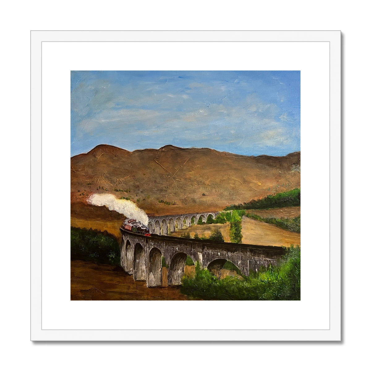 White framed Glenfinnan Viaduct canvas print with steam train and mountains