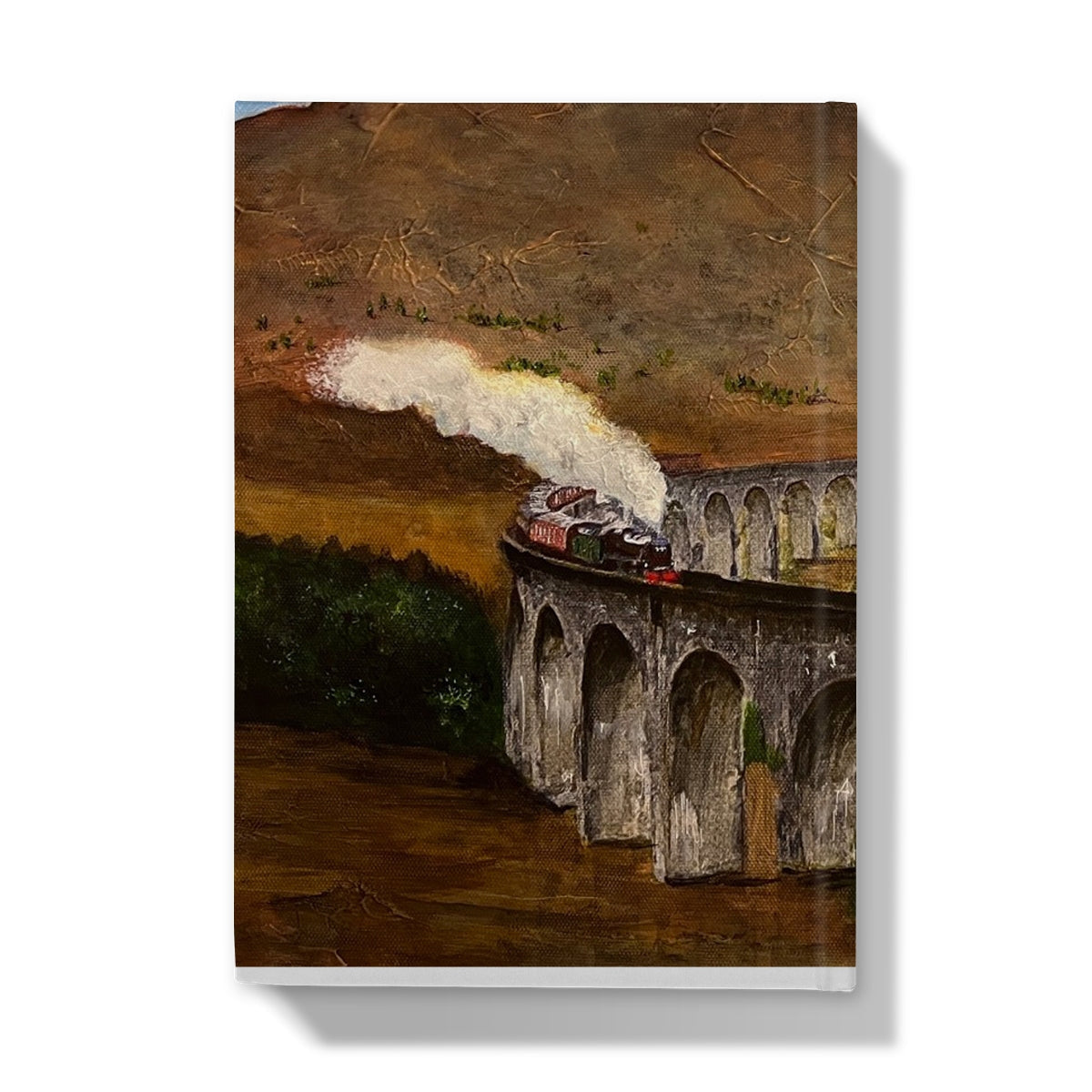 Painting of a steam train crossing Glenfinnan Viaduct on a curved stone arch in a journal