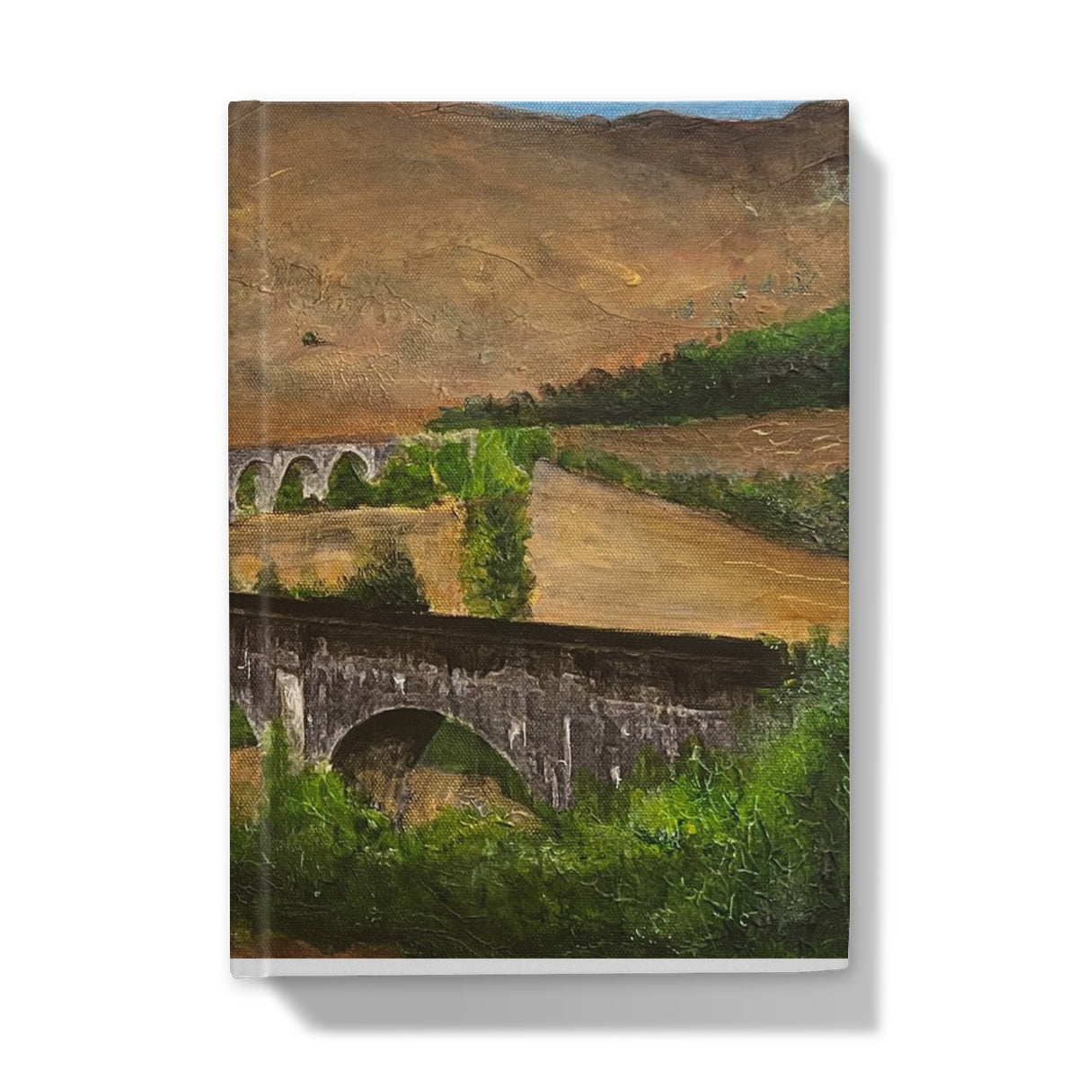 Oil painting of a rural landscape with stone bridges on the Glenfinnan Viaduct Hardback Journal