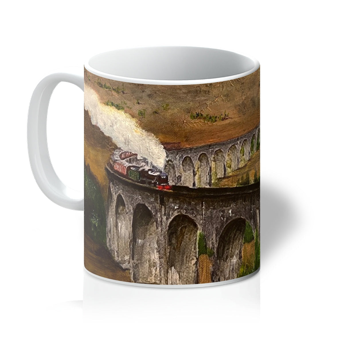 White ceramic Glenfinnan Viaduct Mug featuring a painted train on a viaduct design