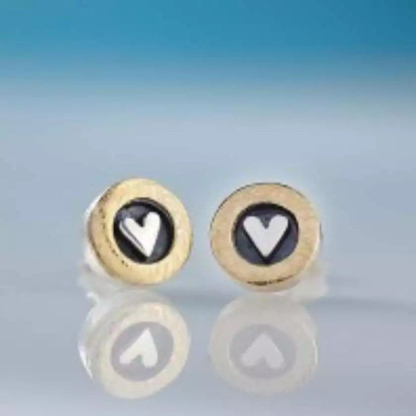 Gold-toned From The Heart stud earrings with white heart on black background