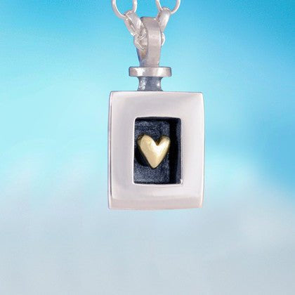 Heart of Gold pendant: silver square with gold heart in dark inset