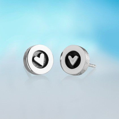 Heart silver stud earrings with polished circular design and black heart cutout, by Alan Ardiff Jewellery