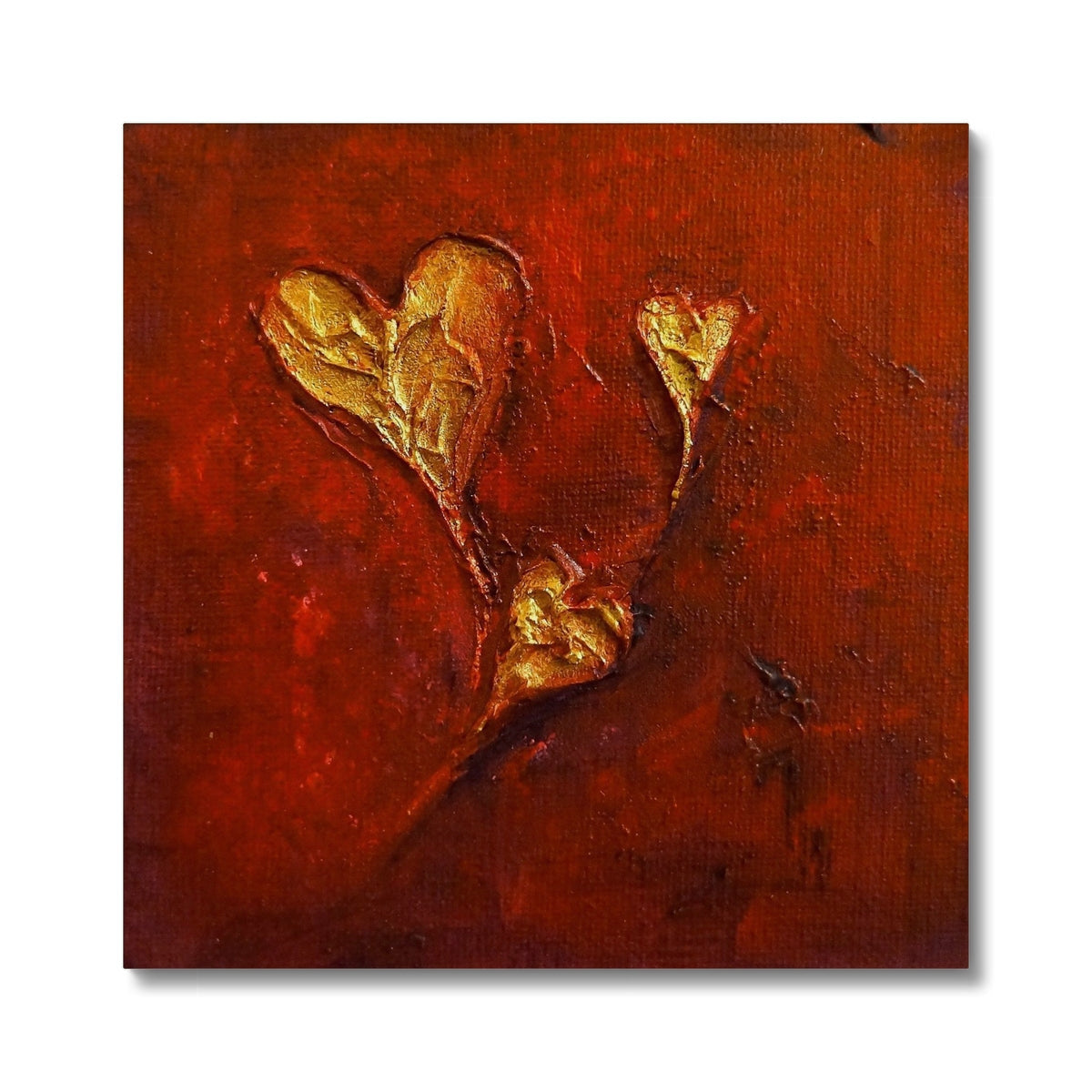 Gold leaf hearts canvas print on red background