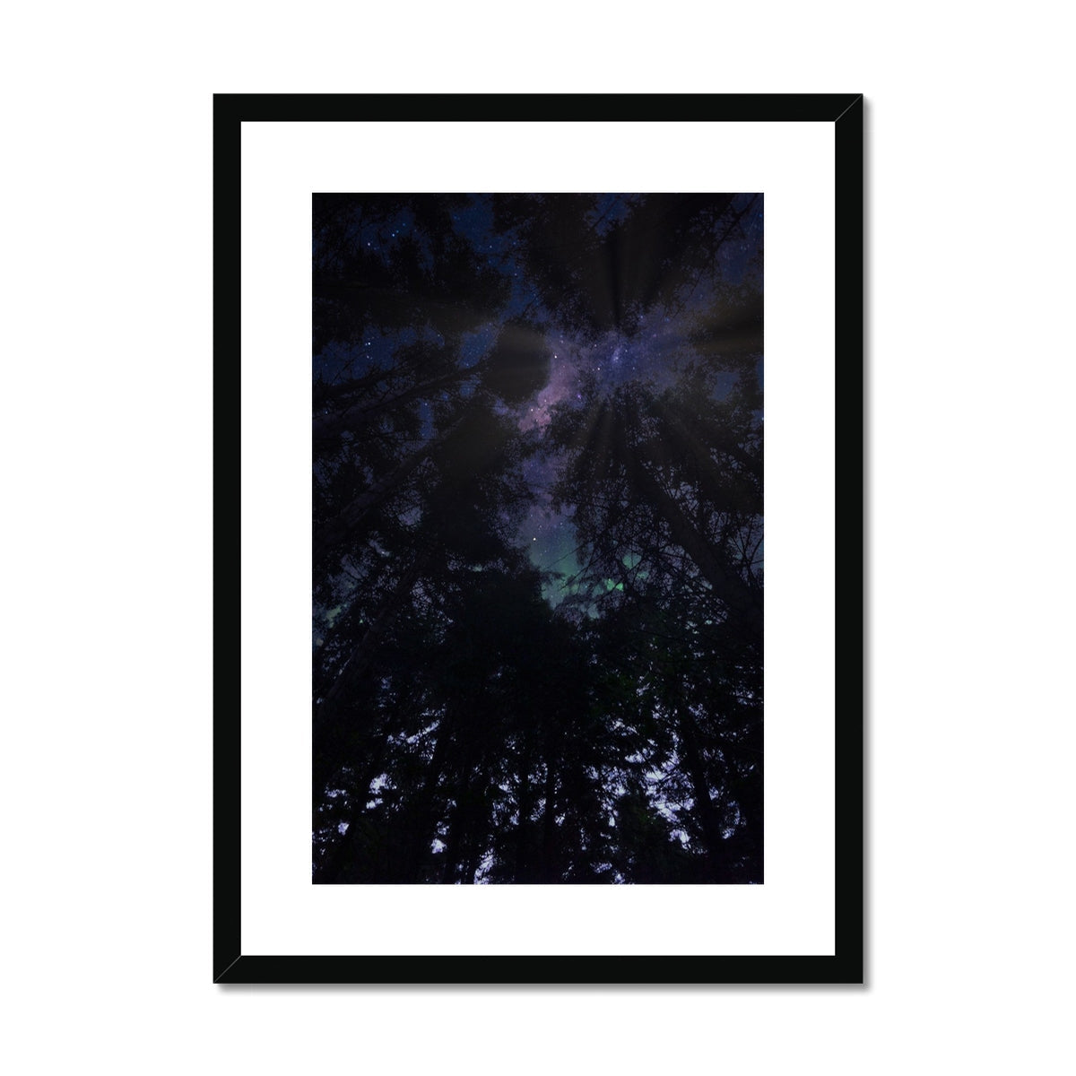 Black framed galaxy art print with white matting and starry sky design