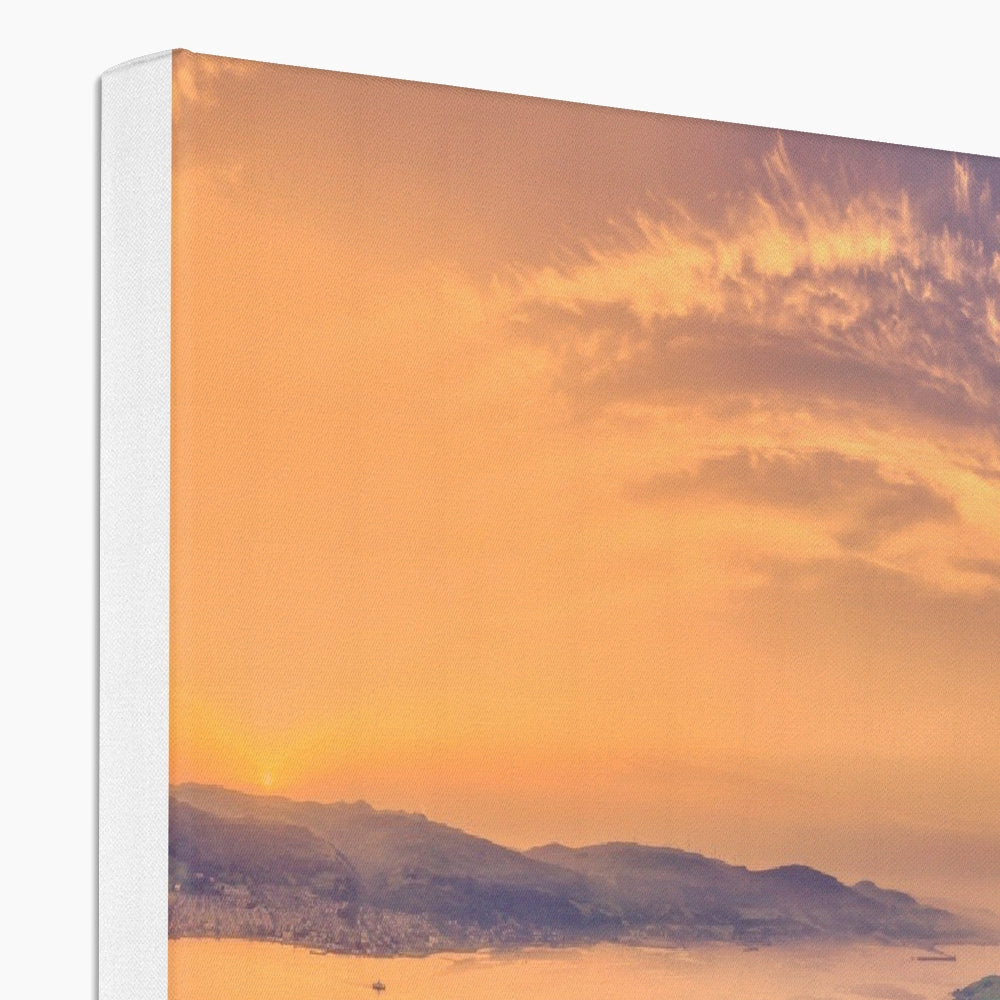 Vibrant orange sunset over Isle of Cumbrae mountains and water canvas print