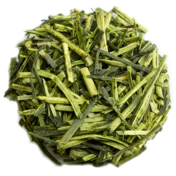 Vibrant green Karigane Kukicha matcha tea leaves pile