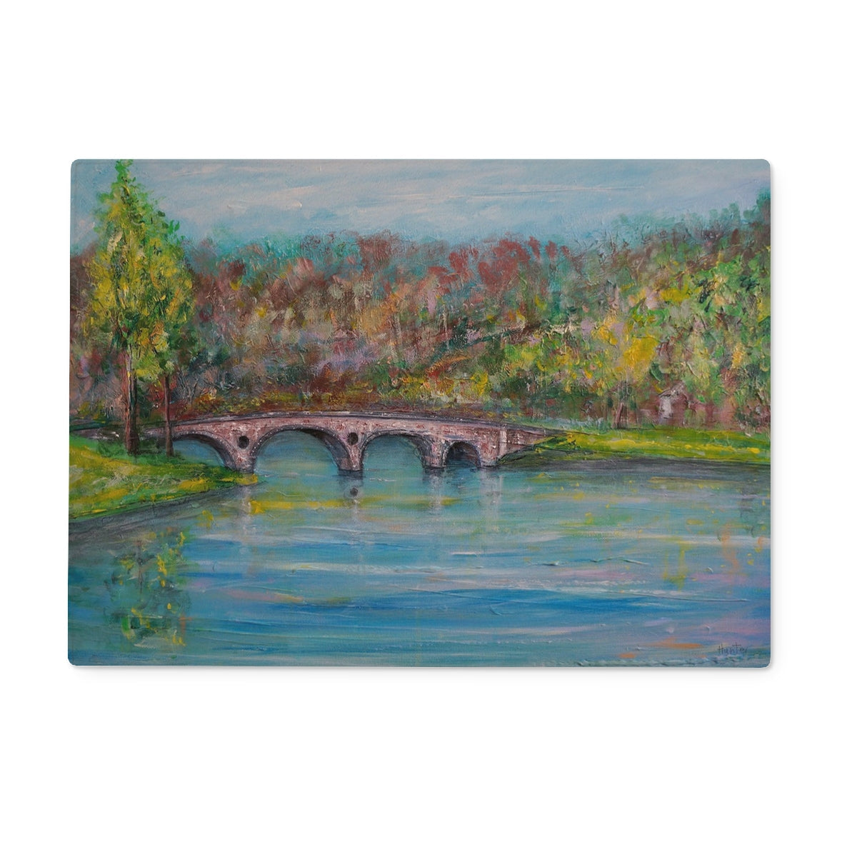 Kenmore Bridge glass chopping board with stone bridge over river, green trees, blue sky