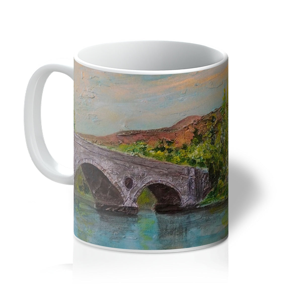 Kenmore Bridge II ceramic mug with stone bridge, earth tones, greenery