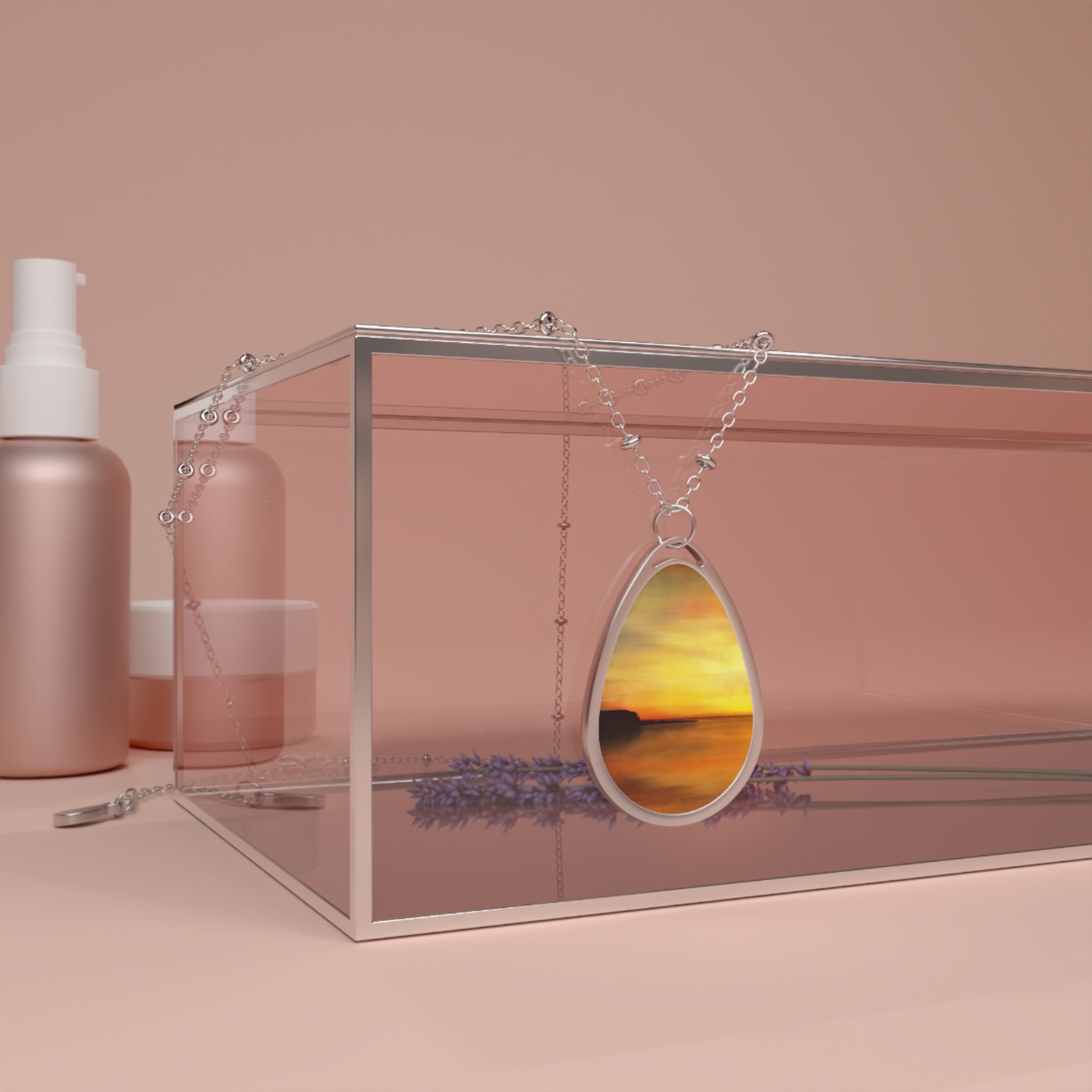 Kings Cave Sunset Arran silver teardrop pendant with vibrant orange sunset