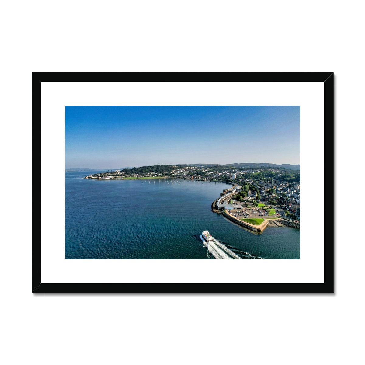 Black-framed Kip Marina coastal print with boat and island