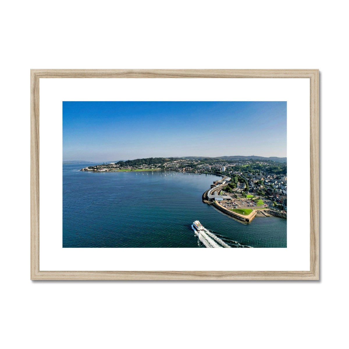 Kip Marina wooden framed canvas print of coastal boat and town scene