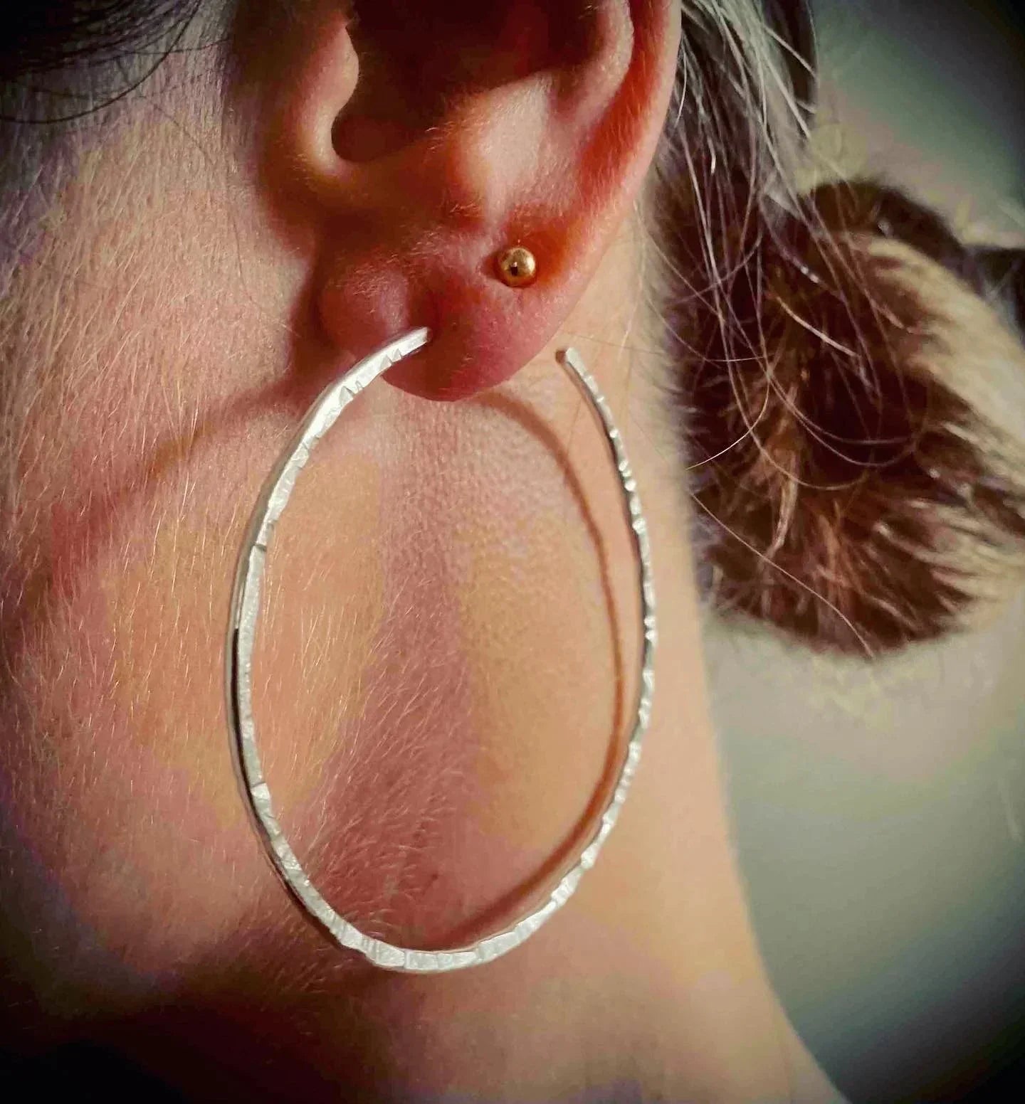 Silver hammered hoop earring with gold stud from Genna Miller Jewellery