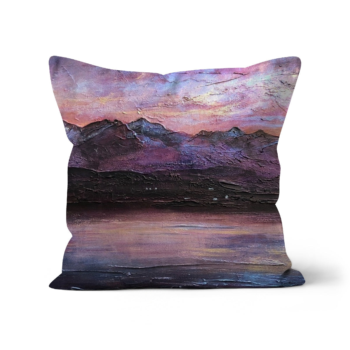 Last Skye Light Cushion featuring an impressionistic mountain and lake landscape in purple, pink, and dark blue tones
