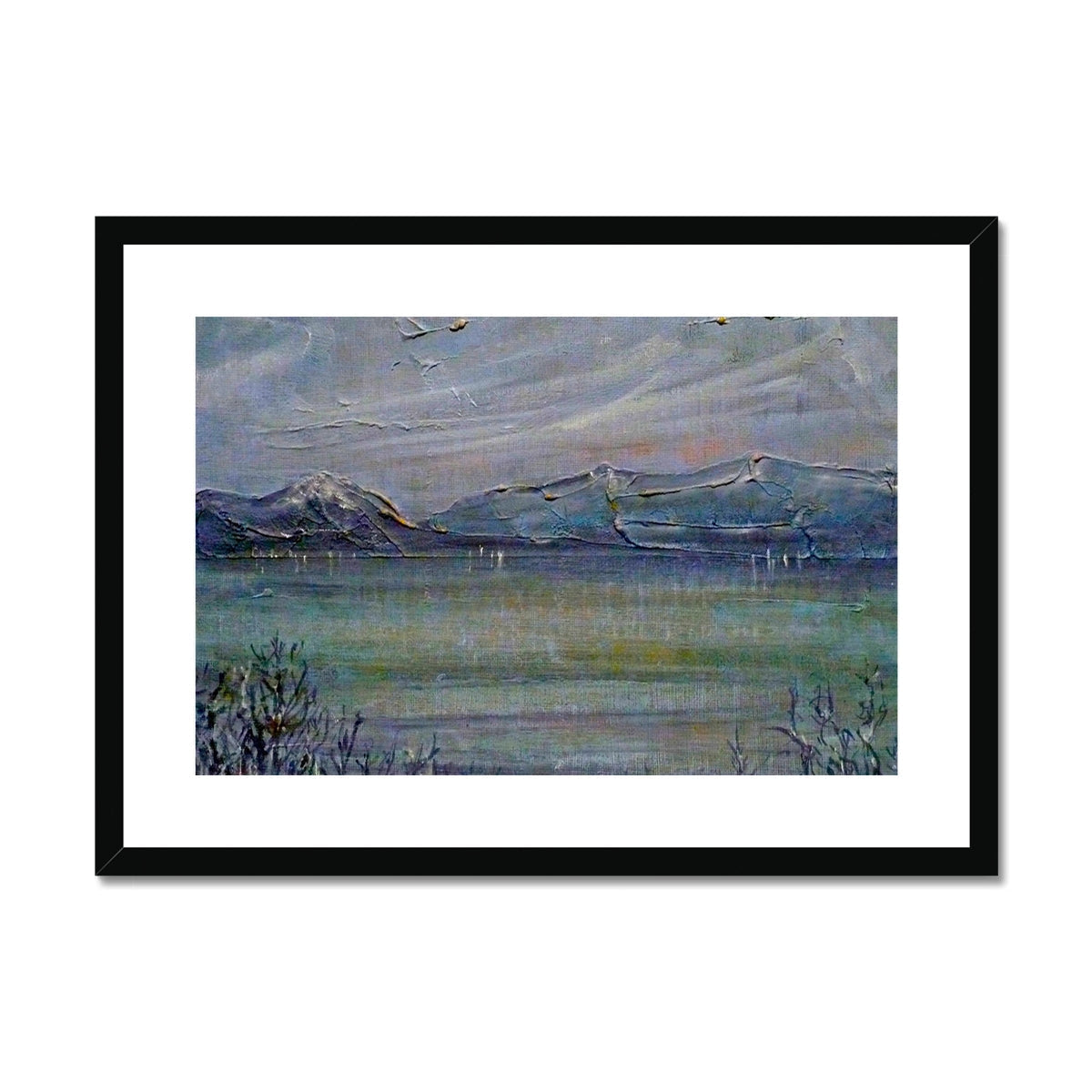 Black framed landscape print of snowy mountains and calm water titled Loch Morlich Moonlight
