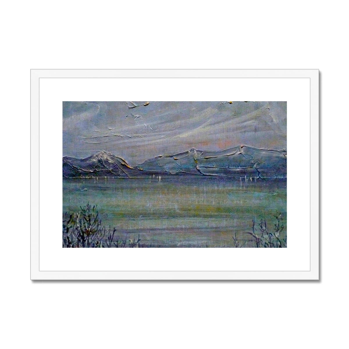 White framed landscape print of Loch Morlich with mountains and water in muted tones