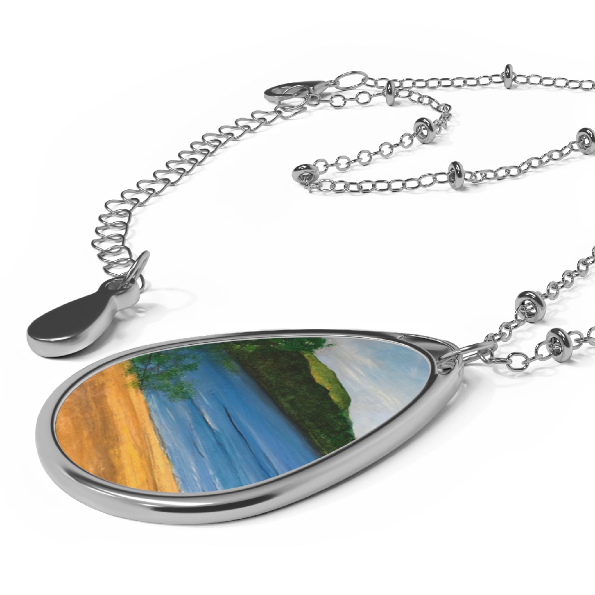 Silver teardrop-shaped pendant necklace featuring a colorful Loch Rannoch landscape painting