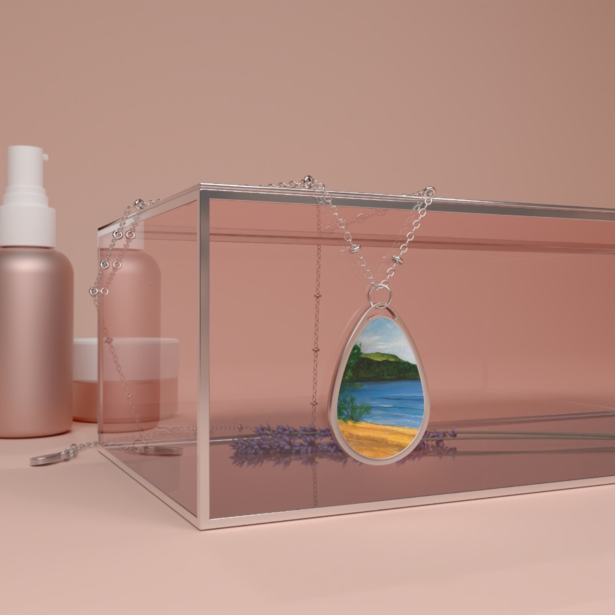 Silver teardrop necklace with painted beach scene pendant featuring blue water and yellow sand